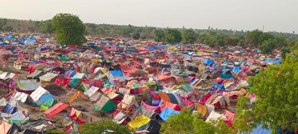 Some of the 10,000 huts and tents on the occupied land, 25 May 2022. Photo: Jagadish Kumar.